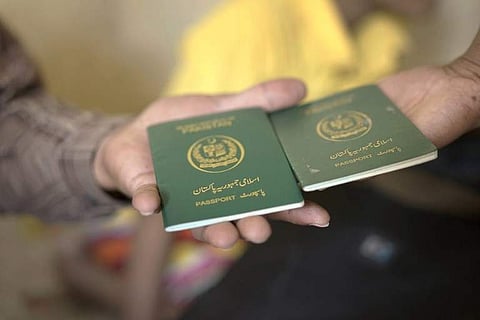 This photo taken on November 3, 2018 shows Pakistani passports of family members of Pakistani-Christian refugees seeking refuge in a small apartment in Bangkok suburb after fleeing persecution in Pakistan in 2013 while the group fear arrest by Thai author