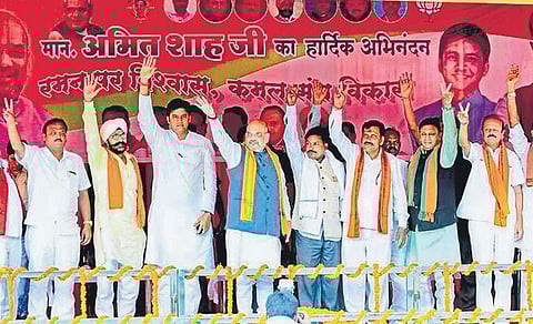 BJP president Amit Shah, with state unit party leaders, at a rally in Rajnandgaon district, Chhattisgarh on Sunday | pti