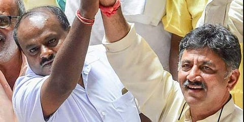 JD(S) leader HD Kumaraswamy with Congress leader D K Shivakumar. (Photo | PTI)