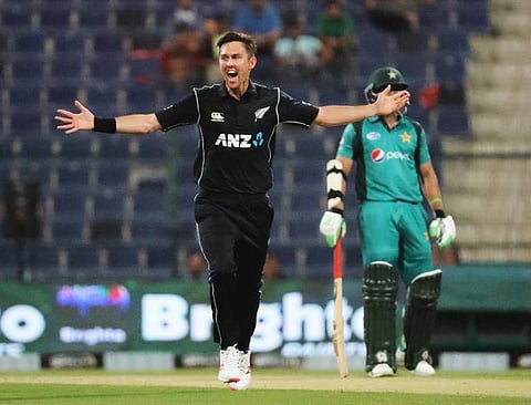 New Zealand cricketer Trent Boult (L) celebrates after he dismissed Pakistan batsman Babar Azam during the first one day international (ODI) cricket match between Pakistan and New Zealand at the Sheikh Zayed Cricket Stadium in Abu Dhabi. (Photo | AFP)