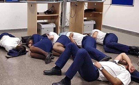 The Ryanair flight crew  were seen getting into a position on the floor for the snap. After the picture was taken, the staffers got up and walked away. (Photo | Twitter)