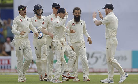 England's Moeen Ali, second right, celebrates the dismissal of Sri Lanka's Niroshan Dickwella with team mates during the fourth day of the first test | AP