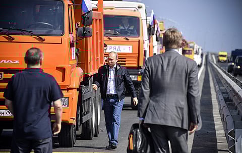 Russian President Vladimir Putin walks after driving a truck to officially open the much-anticipated bridge linking Russia and the Crimean peninsula, during the opening ceremony near in Kerch, Crimea, Tuesday, May 15, 2018. | AP Photo