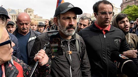 Armenia’sprime minister Nikol Pashinyan surrounded by journalists and supporters in Yerevan. (Photo| AFP)