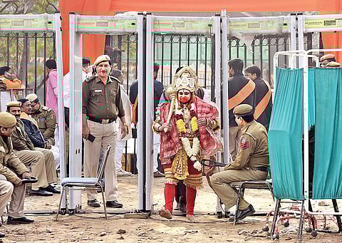 A man dressed as Lord Hanuman arrives at Ramlila Maidan on Sunday