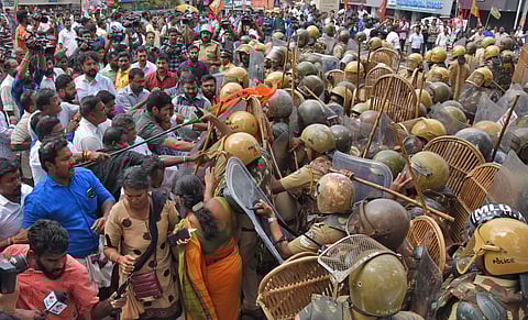 The BJP workers threw stones and hurled chairs at police personnel. (Photo | EPS/BP Deepu)