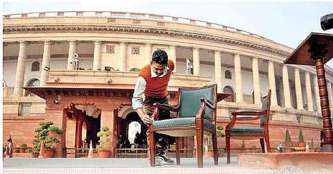 Parliament House staff polish chairs a day before the winter session begins today (Photo | EPS/Shekhar Yadav)