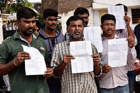 Vehicle drivers who worked during elections demand their dues be paid at Amberpet GHMC grounds on Monday (Photo | EPS/Vinay Madapu)