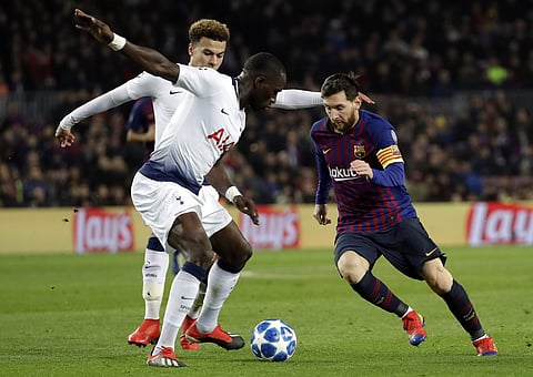 Barcelona forward Lionel Messi, right, vies for the ball with Tottenham midfielder Moussa Sissoko during the Champions League group B soccer match between FC Barcelona and Tottenham Hotspur at the Camp Nou stadium in Barcelona. (Photo | AP)