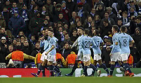 Manchester City's Leroy Sane celebrates with his teammates after scoring his side's first goal during the Champions League Group F match against Hoffenheim at the Etihad stadium (Photo | AP)