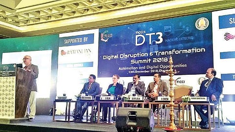 K Dinesh, co-founder of Infosys, addressing the ‘Digital disruption and transformation summit’ organised by FICCI on Thursday | Express
