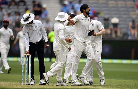 India's paceman Ishant Sharma (R) walks back to the pavilion with teammates at the end of Australia's first inning during day two of the second Test cricket match between Australia and India in Perth. (Photo | AFP)