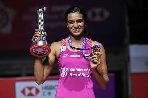 Winner Sindhu Pusarla of India poses with her trophy after the women's singles final match at the 2018 BWF World Tour Finals badminton competition in Guangzhou in southern China's Guangdong province on December 16, 2018. (Photo | AFP)