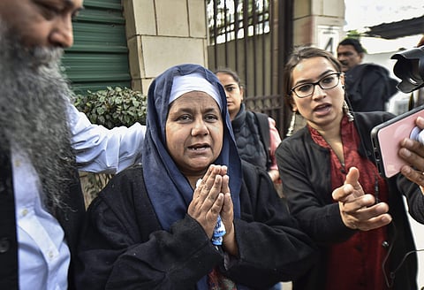 Nirpreet Kaur whose father was killed during 1984 anti-Sikh riots reacts after the Delhi High Court convicted Congress leader Sajjan Kumar for criminal conspiracy promoting enmity acts against communal harmony in the case and sentenced him to life impriso