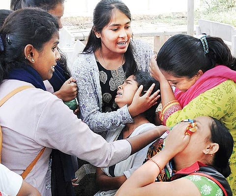 Inconsolable family members of deceased Malli Bai outside KR Hospital in Mysuru on Monday | Udayashankar S