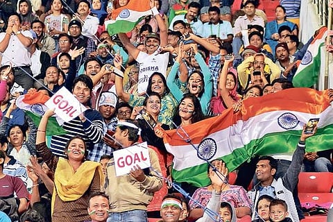 Audience cheer for India during a Hockey World Cup match.
