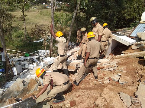 Rescue officials clearing the debris at  I Mulbagal Desai Residential School (Photo | EPS)