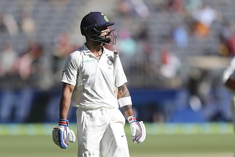 India's Virat Kohli walks off after being dismissed during play in the second cricket test between Australia and India in Perth, Australia, Monday, Dec. 17, 2018. | AP