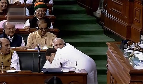 Congress President Rahul Gandhi hugs Prime Minister Narendra Modi after his speech in the Lok Sabha on 'no-confidence motion' during the Monsoon Session of Parliament in New Delhi. (File Photo | PTI)