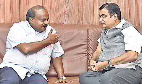 Chief Minister H D Kumaraswamy interacts with Union Minister for Road Transport and Highways Nitin Gadkari in Bengaluru on Saturday | Express