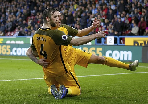 Brighton & Hove Albion's Shane Duffy (L) celebrates scoring his side's first goal of the game with team-mate Lewis Dunk | AP