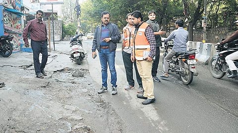 GHMC commissioner M Dana Kishore along with other senior officials inspects the road in front of the Apollo Hospital | Express
