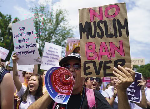 Protesters call out against the Supreme Court ruling upholding President Donald Trump's travel ban outside the Supreme Court on Capitol Hill (File Photo | AP)