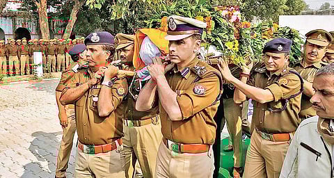 Police officers pay tribute to Inspector Subodh Kumar Singh, who was killed in the Bulandshahr mob violence, at Etah. 