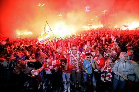 Croatian fans in Zagreb cheer while watching the semifinal match between Croatia and England (File Photo | AP)