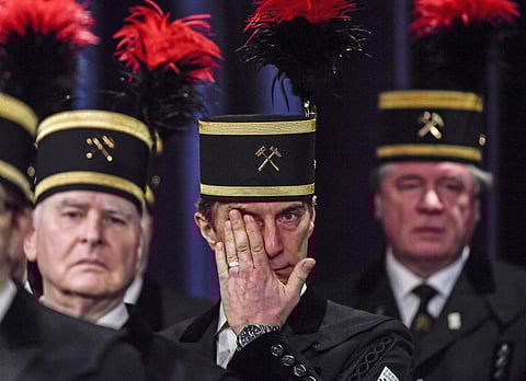 A coal miner in a traditional dress hides tears during a closing ceremony of the last German coal mine Prosper-Haniel in Bottrop, Germany (Photo | AP)