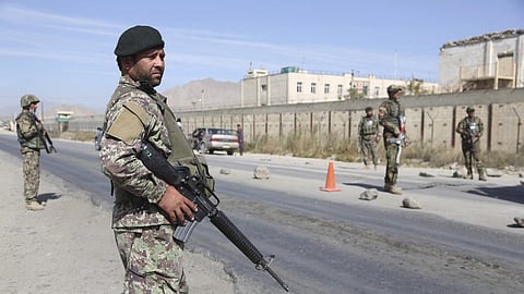 Afghan National Army soldiers stand guard at a checkpoint in Kabul, Afghanistan.