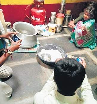 Officials collecting samples of Jowar flour and other things at Hulithotlu village in Chitradurga | Express