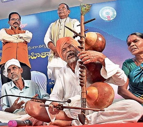 Kumara Lingu, a native of Chunchu village in Adilabad (TS), plays the Mettela Kinnera instrument at a seminar on tribal literature in the city | RVK Rao