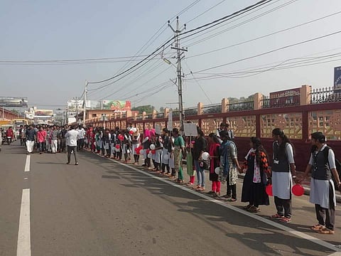 Students form wall outside NSS College (Facebook photo)