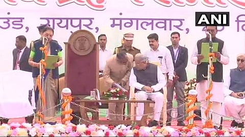 Chhattisgarh governor Anandiben Patel administering the oath of office during the swearing-in ceremony in Raipur on Tuesday. (Photo | ANI/Twitter)