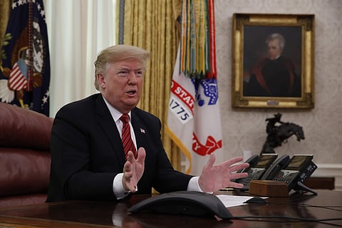 President Donald Trump greets members of the five branches of the military by video conference on Christmas Day, Tuesday, Dec. 25, 2018, in the Oval Office of the White House. (Photo | AP)