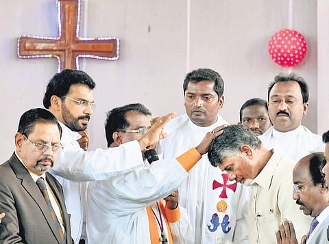 Chief Minister N Chandrababu Naidu being blessed by priests of  Saint Pauls Basilica Church in Vijayawada on Tuesday I Express