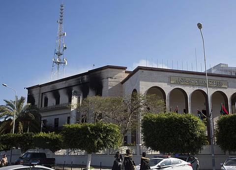Fire damaged the foreign ministry building, after a deadly attack, in Tripoli, Libya on Tuesday. (AP photo)