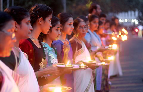 Devotees participating in the Ayyappa Jyothi programme in Thiruvananthapuram on Wednesday organised by the Sabarimala Karma Samithi seeking protection of the customs at Sabarimala (Photo | BP Deepu/ EPS)
