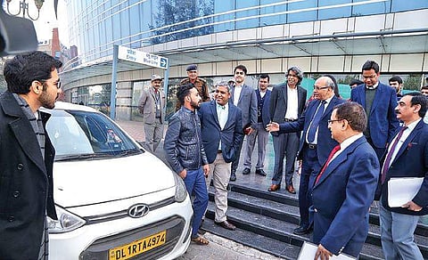 The first Uber cab, booked by DMRC Managing Director Mangu Singh, arrives at the Rajiv Chowk metro station on Wednesday | EXPRESS