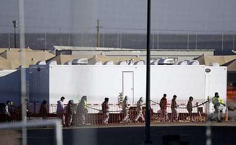 Migrant teens walk in a line through the Tornillo detention camp in Tornillo, Texas. (File photo|AP)