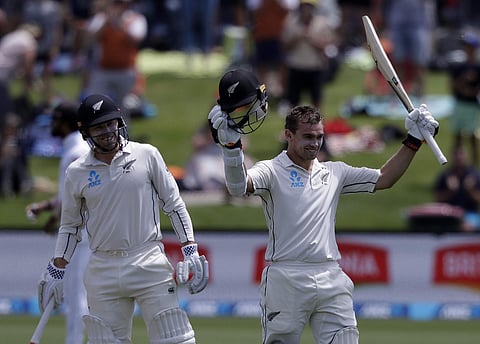 New Zealand's Tom Latham celebrates after reaching his century with teammate Henry Nicholls on day 3 of the 2nd Test. (AP Photo)