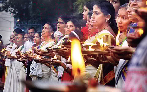 Devotees participating in the Ayyappa Jyothi programme in Thiruvananthapuram on Wednesday, organised by the Sabarimala Karma Samithi seeking protection of the customs at Sabarimala Lord Ayyappa temple | B P Deepu