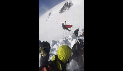 In this grab taken from validated UGC provided on Thursday, Dec. 27, 2018, a boy is airlifted after an avalanche, on the French Alps on Wednesday. (Photo | UGC via AP)