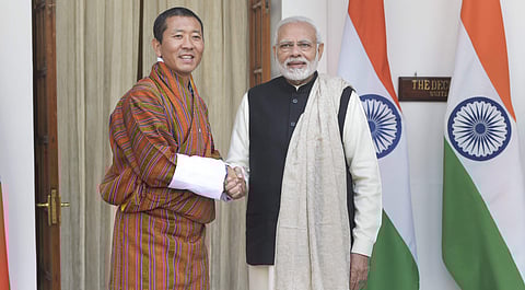 Prime Minister Narendra Modi shakes hands with his Bhutanese counterpart Lotay Tshering before their meeting at Hyderabad House in New Delhi. (Photo |PTI)
