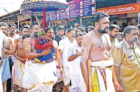 Thantri Kandararu Rajeevararu and melsanthi V N Vasudevan Namboothiri leading the procession carrying the Brahmakalasam as part of Mandalapooja day at Sabarimala Lord Ayyappa temple on Thursday | SHAJI VETTIPURAM