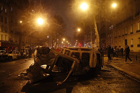 Charred cars are pictured after a demonstration Saturday, Dec.1, 2018 in Paris. (Photo: AP)