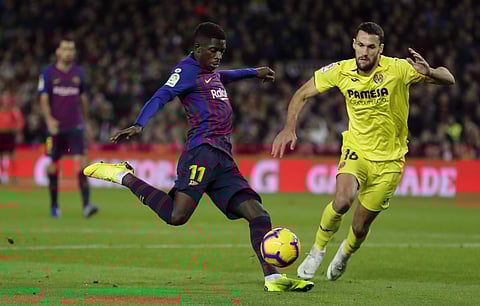 FC Barcelona's Dembele, left, duels for the ball with Villarreal's Alfonso Pedraza during the Spanish La Liga soccer match between FC Barcelona and Villarreal at the Camp Nou stadium in Barcelona. (Photo | AP)