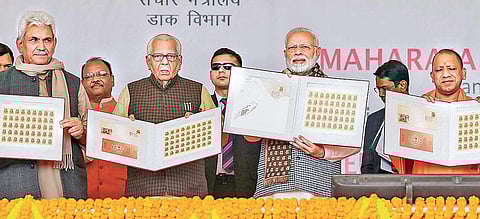 (L-R) MoS for Communications and Railways Manoj Sinha, Uttar Pradesh Governor Ram Naik, Prime Minister Narendra Modi and UP Chief Minister Yogi Adityanath release the commemorative postal stamp on Maharaja Suheldev, in Ghazipur on Saturday (Photo | PTI)