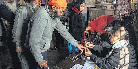 A voter gets his finger marked after casting his vote for the state’s panchayat elections on the outskirts of Amritsar on Sunday (File Photo | PTI)